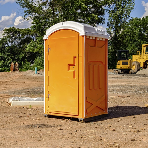 what is the cost difference between standard and deluxe portable toilet rentals in Caledonia New York